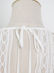 Hollow top + high-waisted cake splicing skirt two-piece set