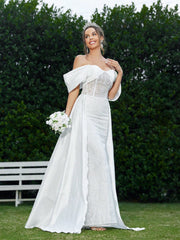 Elegant And Romantic Off-Shoulder Wedding Dress With Pleating Details And Embroidered Fabric.